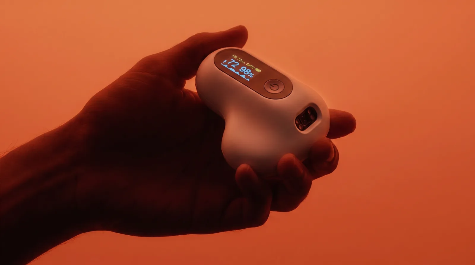A handheld pulse oximeter representing a patented physical hardware product