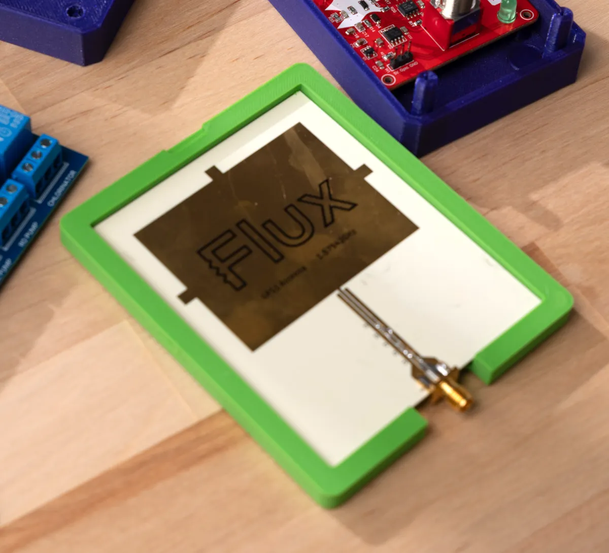 GPS antenna board with an SMA connector sitting flush in its Flux-generated enclosure